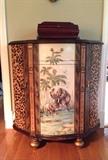 African themed demilune cabinet