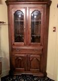 Solid Rock Maple, high quality, corner china cabinet by Temple-Stuart.  Lighted interior, glass shelves, brass hardware.  Doors have convex glass.  Storage for china, crystal, display, etc.