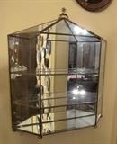 Wall mount or tabletop Brass and glass curio cabinet.  Has glass shelves and mirrored back.