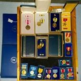 Tray lot of generational family medals and citations with info