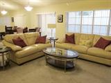Beige Leather Sofa and Loveseat