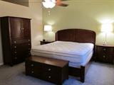 King Bedroom Suite includes Headboard/Footboard Frame, (2) Nightstands, Armoire, Dresser/Mirror, Blanket Chest with Cedar lining.
