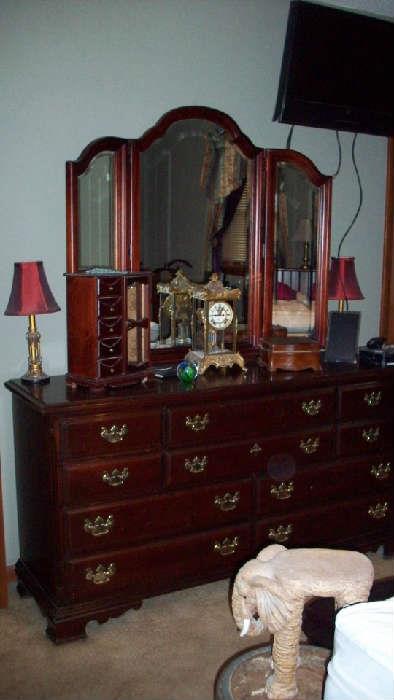 Dresser with mirror, TV on wall