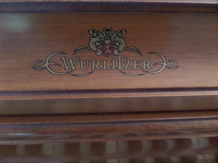 this Wurlitzer piano is in excellent condition 