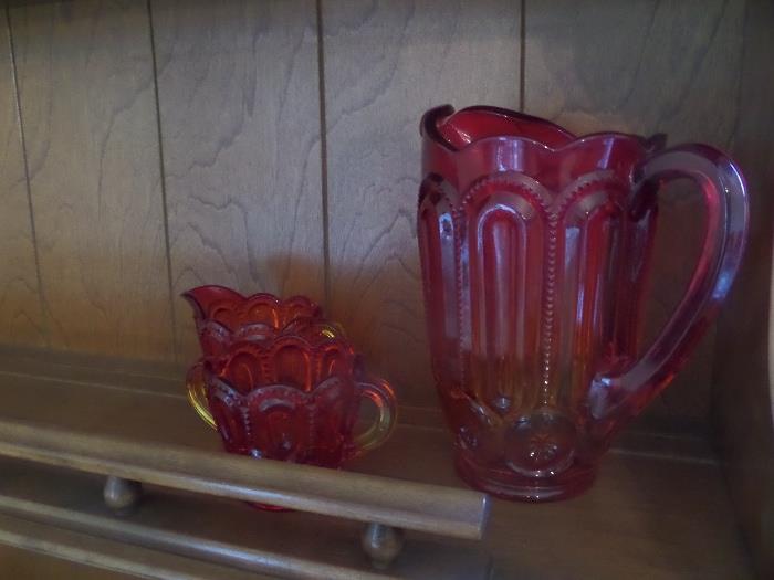 there are several pieces of crystal / glass ware and china