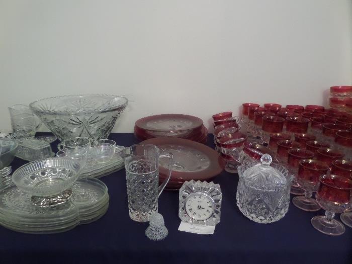 there are several pieces of crystal / glass ware and china