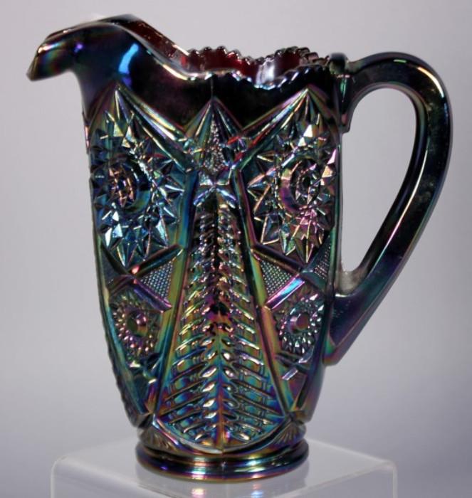 Dark Purple Iridescent Depression Glass Pitcher With Detailed Design, 8.25" Tall    http://bid.auctionbymayo.com/view-auctions/catalog/id/7786/lot/1040380/?url=%2Fview-auctions%2Fcatalog%2Fid%2F7786%2F%3Fpage%3D1%26items%3D100