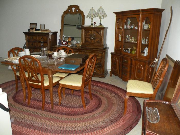 Braided rug. Basset dining room table and 5 chairs with matching hutch.