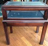 Glass-enclosed display side table