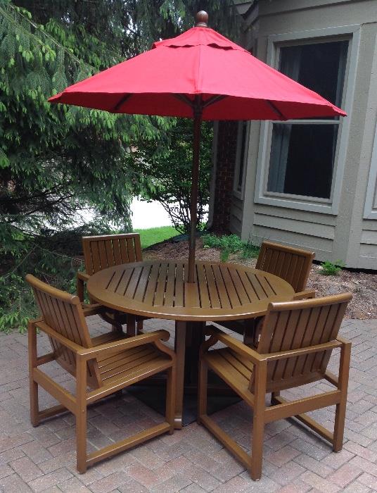 Kingsley-Bates 60" Round Teak Table and Chairs with Market Umbrella.  Stained and oiled annually and stored inside - like new!  AVAILABLE FOR PRE-SALE.