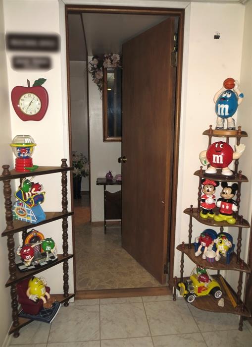 Four and Five tier shelves. M&M and Mickey Mouse collectables