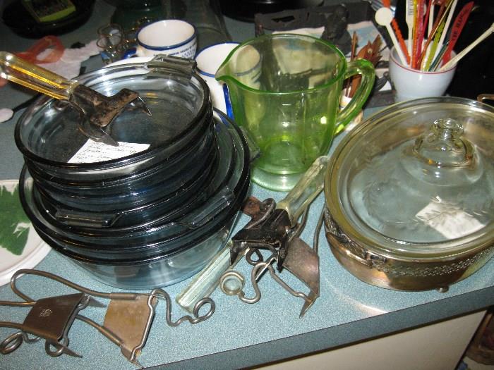 Pyrex glass cooking pots with handles.  Green measuring cup from depression era.