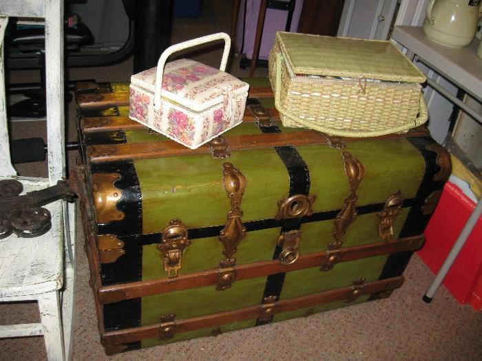Another trunk and sewing baskets.