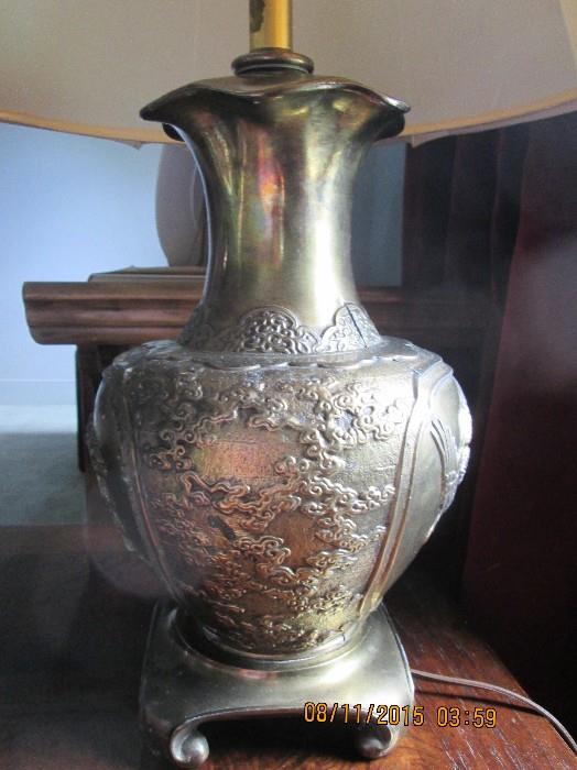 One of a pair of Oriental brass lamps