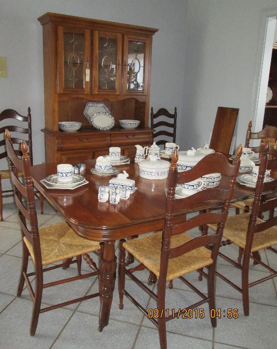 Vintage cherry dining table, 6 ladder-back chairs with rush seats, oak hutch with leaded glass doors