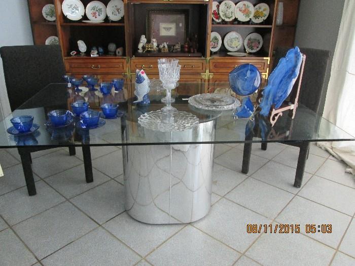 Chrome based glass dining table with 4 parson's chairs