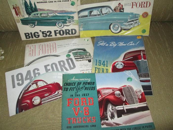 A FEW examples of vintage car brochures, etc