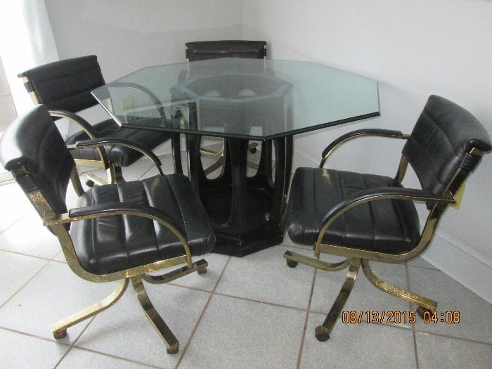 Vintage glass top table with 4 comfortable rolling chairs