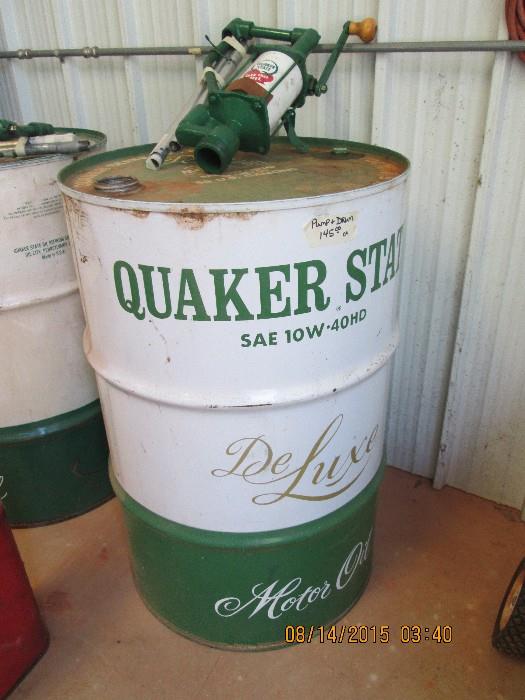 One of 2 Quaker State oil drum w/ matching pump