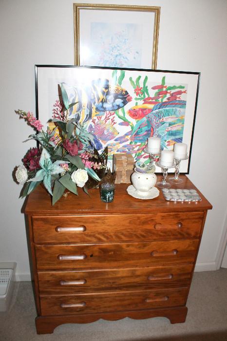 Dresser, artwork, and home decor