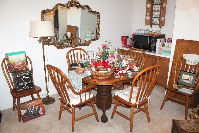 Round oak clawfoot table with leaf and 6 chairs, microwave, Christmas and entertaining items, and more!