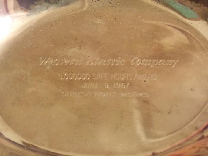 Engraved on the silver-plated tray.