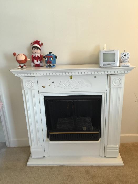 White free standing real looking fireplace in good condition with big box supply of odorless Non toxic wood substitute for flame and heating 
Make offer