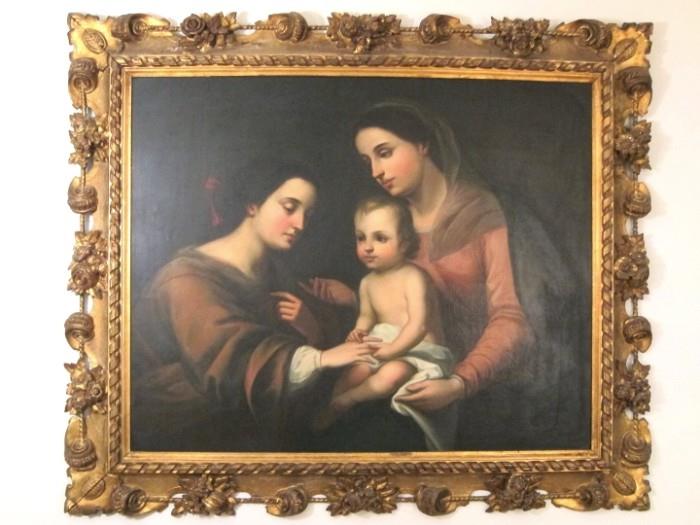 19th century Spanish or Italian oil on board painting of St. Catherine of Alexandria with the Madonna and Child, housed in exquisite French carved gilt wood and gesso frame.