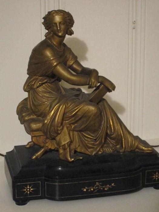 Early 20th century gilt metal sculpture of classically draped woman.