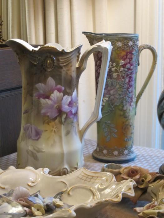 R. S. Prussian hand-painted porcelain pitcher and Nippon moriage pitcher.