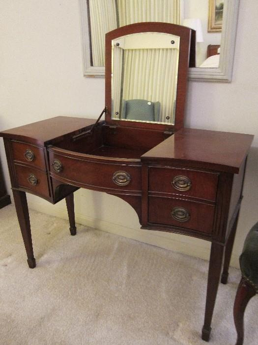 Vintage Drexel mahogany vanity table with lift-up mirrored top.