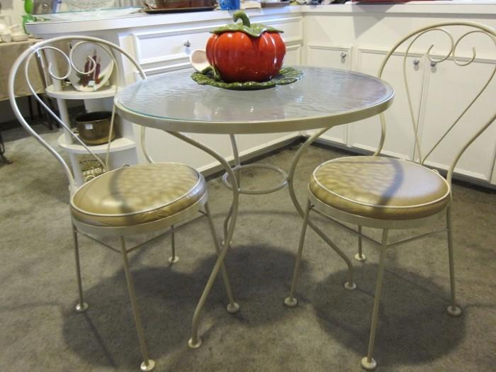 Winston wrought iron breakfast set with glass top table.