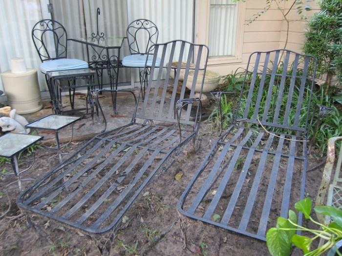 A few pieces from the large collection of wrought iron patio furniture.
