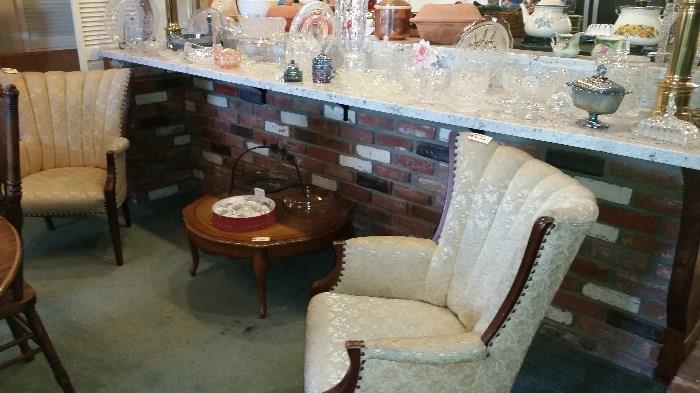 Lots of crystal and glass.  1940's easy chairs