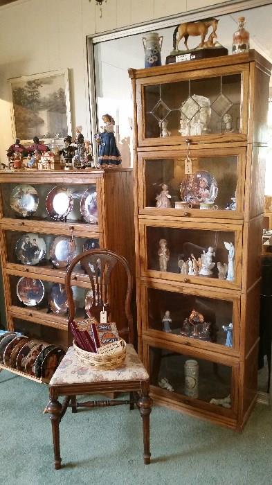 Lawyers bookcases, figurines and collector plates.