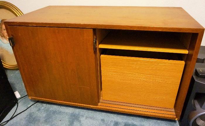 Mid Century modern file cabinet. The inside is solid Oak and the original legs are inside the drawer to the right. It is an incredible piece of mid century design