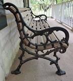 Kings River Casting 'Woodlands' bench. It has cast aluminum sides and Oak slats