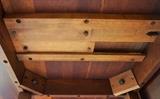 Cherry drop leaf table under side