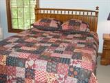 Lexington oak queen size bed.  Pottery barn bedspread and euro pillow shams.