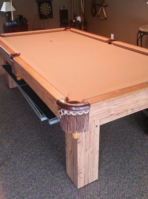 LIKE NEW Brunswick Pool Table that also turns into a Ping Pong Table.  Beautiful Condition with nice leather detail