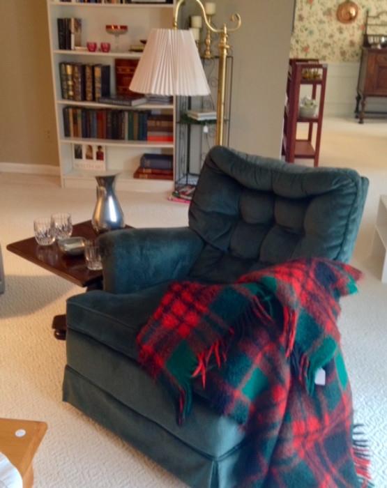 Green Velvet Swivel Rocker, Ethan Allen table, Wood Throw and Beautiful Brass Floor Lamp in front of a bookcase filled with Collectibles and Vintage Books
