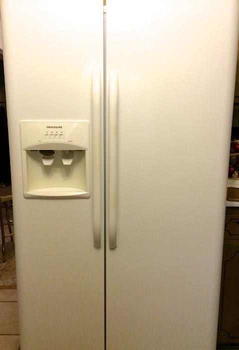 2010 26-cubic -foot Frigidaire side-by-side refrigerator, nice and cold!