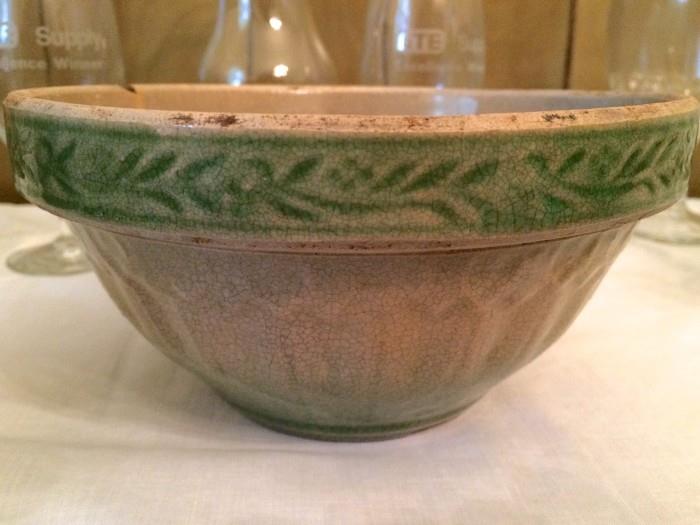 Very old crockery bowl with spring-green rim
