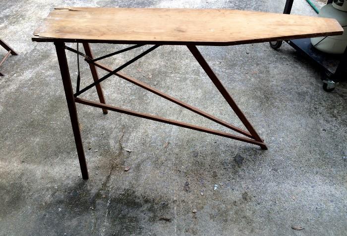 Wooden ironing board, stands sturdily, great for make-shift statement table