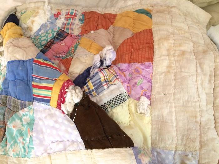 Several hand-sewn quilts are here that could be upcycled 