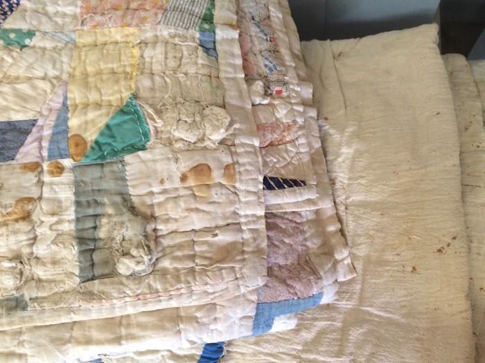 More old quilts awaiting your creative idea for re-use