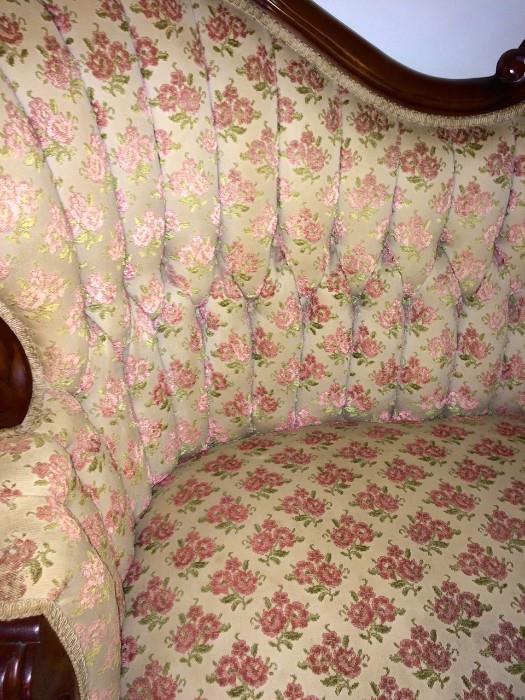 Close-up of Victorian sofa with tufted back