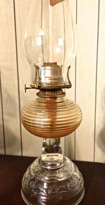 Ridged amber glass belly and etched pedestal on this lovely oil lamp