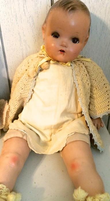 Antique boy doll in matching knitted sweater