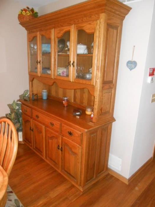 two piece, oak step back hutch with glass window cabinet doors